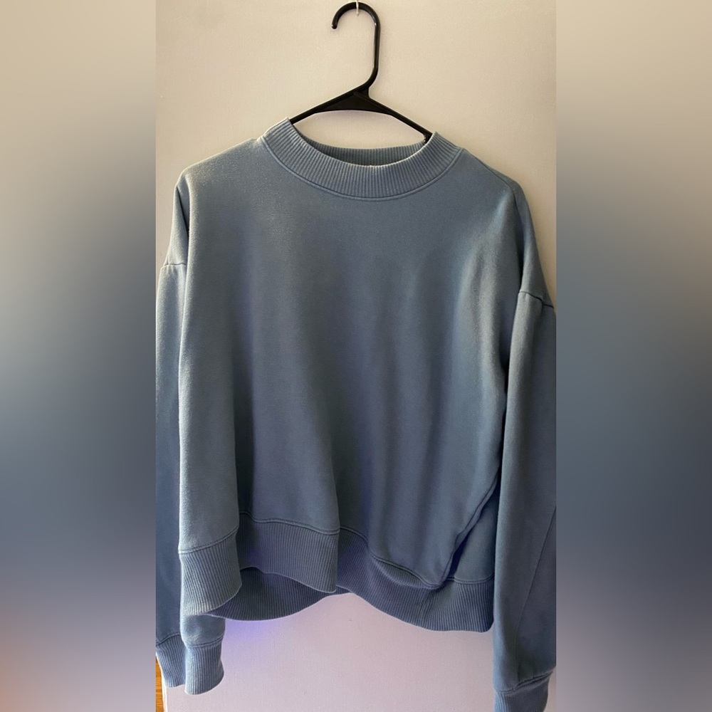 Blue sweater.